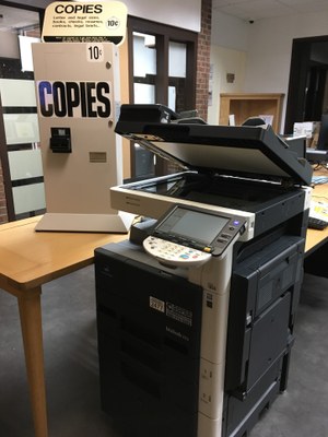 Copy machine with coin slot attached